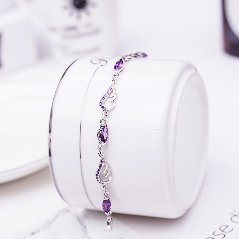 Sterling Silver Angel Wing Bracelet — Purple Crystal Accent